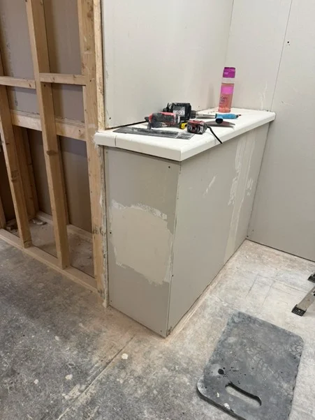 Counter unit in training bay with filler patches and tools for surface preparation