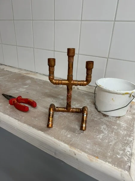 Copper pipe candle holder made during plumbing soldering practice